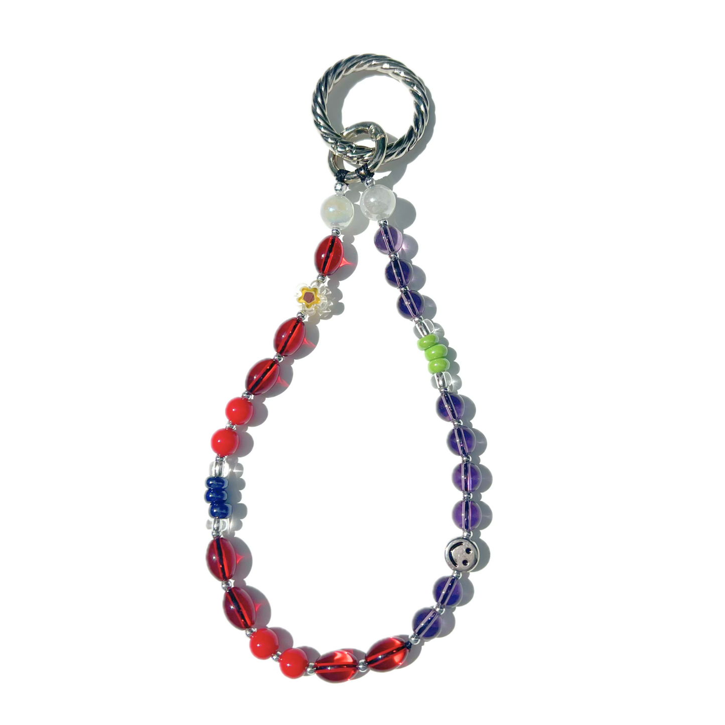 Cherry red and purple eclectic beaded charm with daisy detail, chrome smiley bead, and twist clasp, handmade with glass, Czech, millefiori, and acrylic beads.