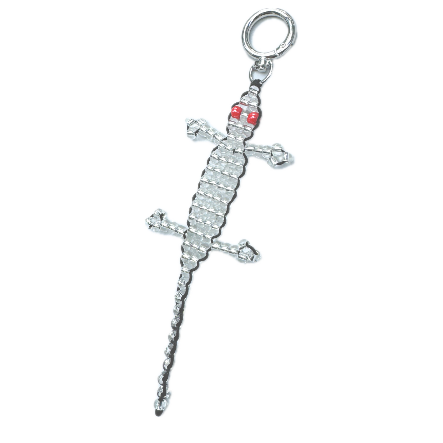 Angled view of the Beaded Silver Gecko Bag Charm, featuring silver glass beads with vivid red bead eyes and a secure keyring clasp.