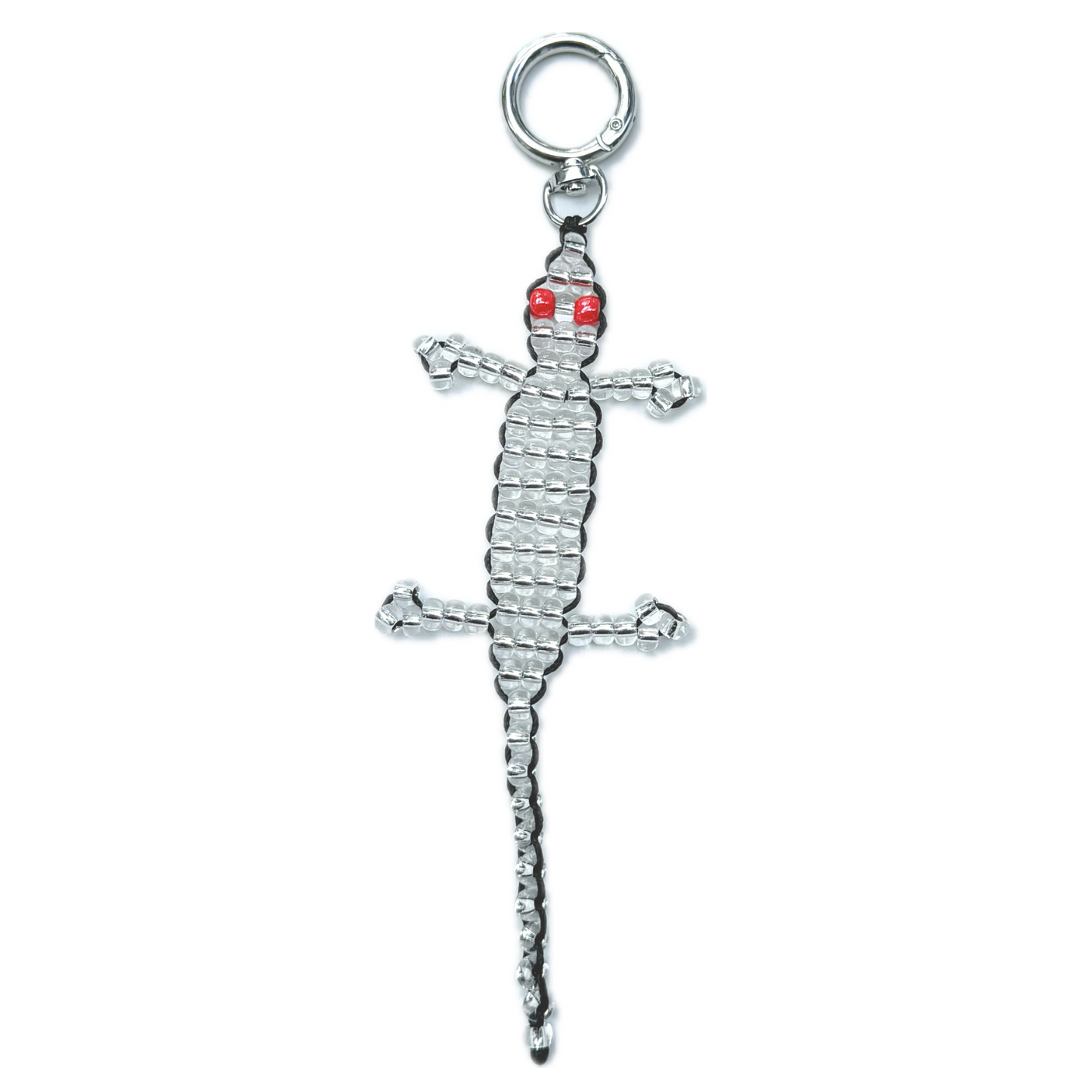 Front view of the Beaded Silver Gecko Bag Charm, a handmade novelty keychain crafted with silver beads and striking red eyes in a lizard design.