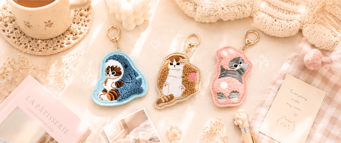 Set of three Japan Import Mofusand embroidered plush keychain charms in shark, strawberry shortcake, and bunny cat costumes