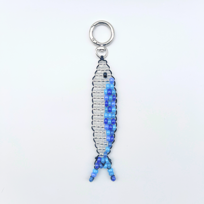 Single blue and silver beaded sardine fish bag charm photographed front-facing on a white background with metal keyring.