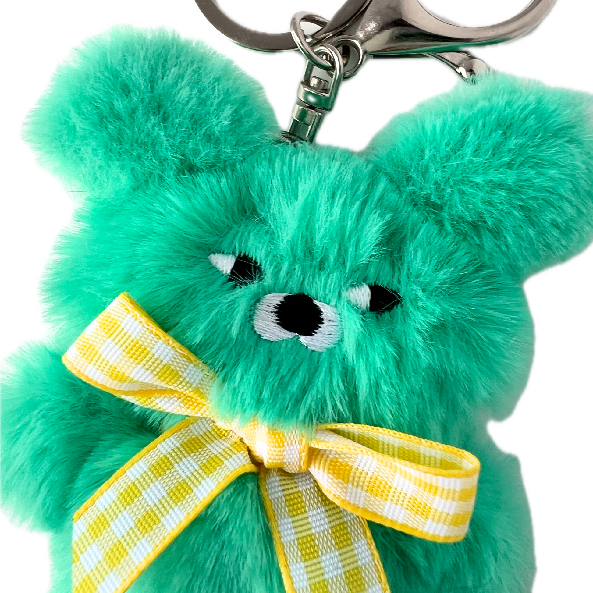 Close-up of cute Wasabi Bear's face with side-eye expression and yellow bow
