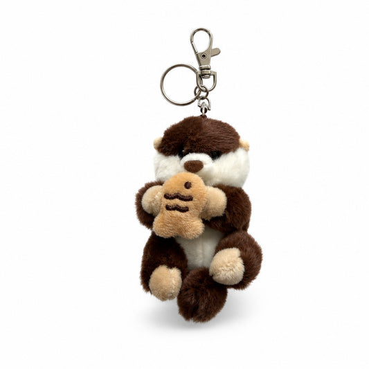 Kawaii Japanese Otter Rakko-san dark brown plush keychain bag charm holding a taiyaki, front view