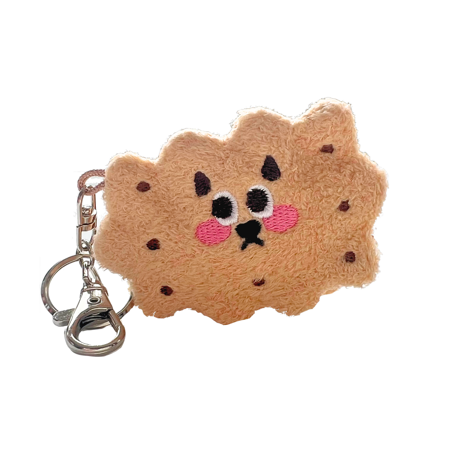 Honey-colored sandwich cookie plush keychain with chocolate chip embroidery, blushing face, and silver hardware clip.