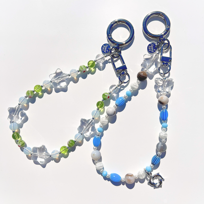 Coastal Muse bag charms in Marina Blue and Tide Pool Green colorways with glass beads, star details, and silver hardware