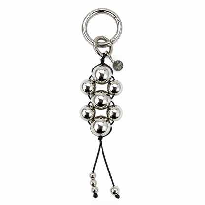 Modern Talisman Chrome Beaded Bag Charm featuring polished chrome spheres handwoven with black cord and a silver keyring.
