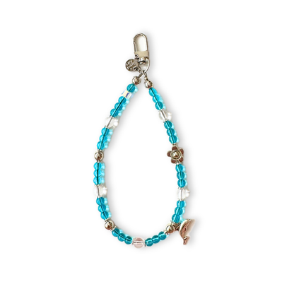 Handmade aqua dolphin beaded phone charm wristlet with turquoise and clear glass beads, a silver flower spacer, dolphin charm and lobster clasp