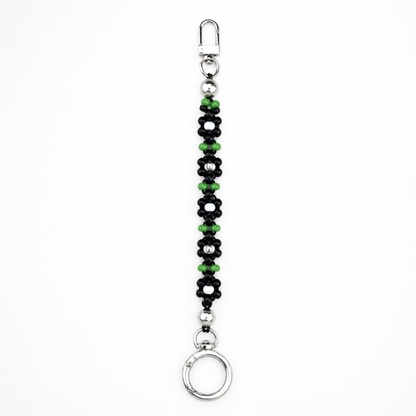 Handmade black and green daisy beaded ID badge holder with silver clasp, cute office accessory