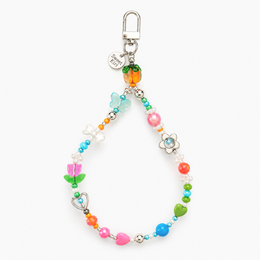 Colorful Garden Party beaded bag charm with a glass persimmon, white daisy and tulip flowers, hearts and green leaf beads on a lobster clasp