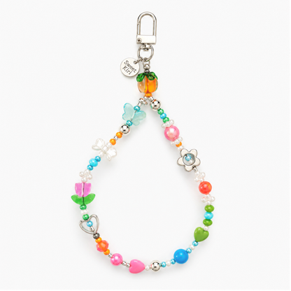 Colorful Garden Party beaded bag charm with a glass persimmon, white daisy and tulip flowers, hearts and green leaf beads on a lobster clasp