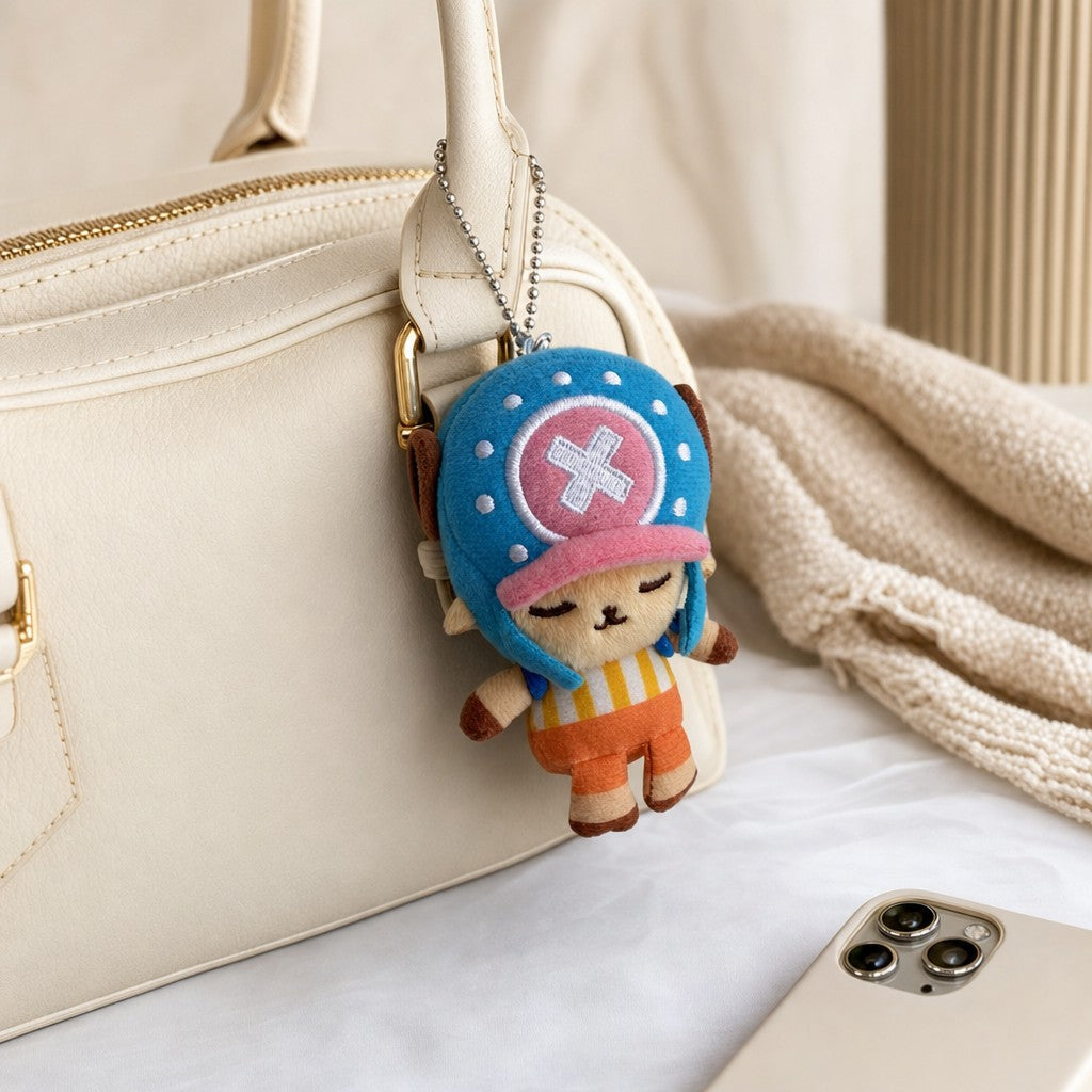 One Piece Tony Tony Chopper plush bag charm clipped onto a handbag with silver ball chain