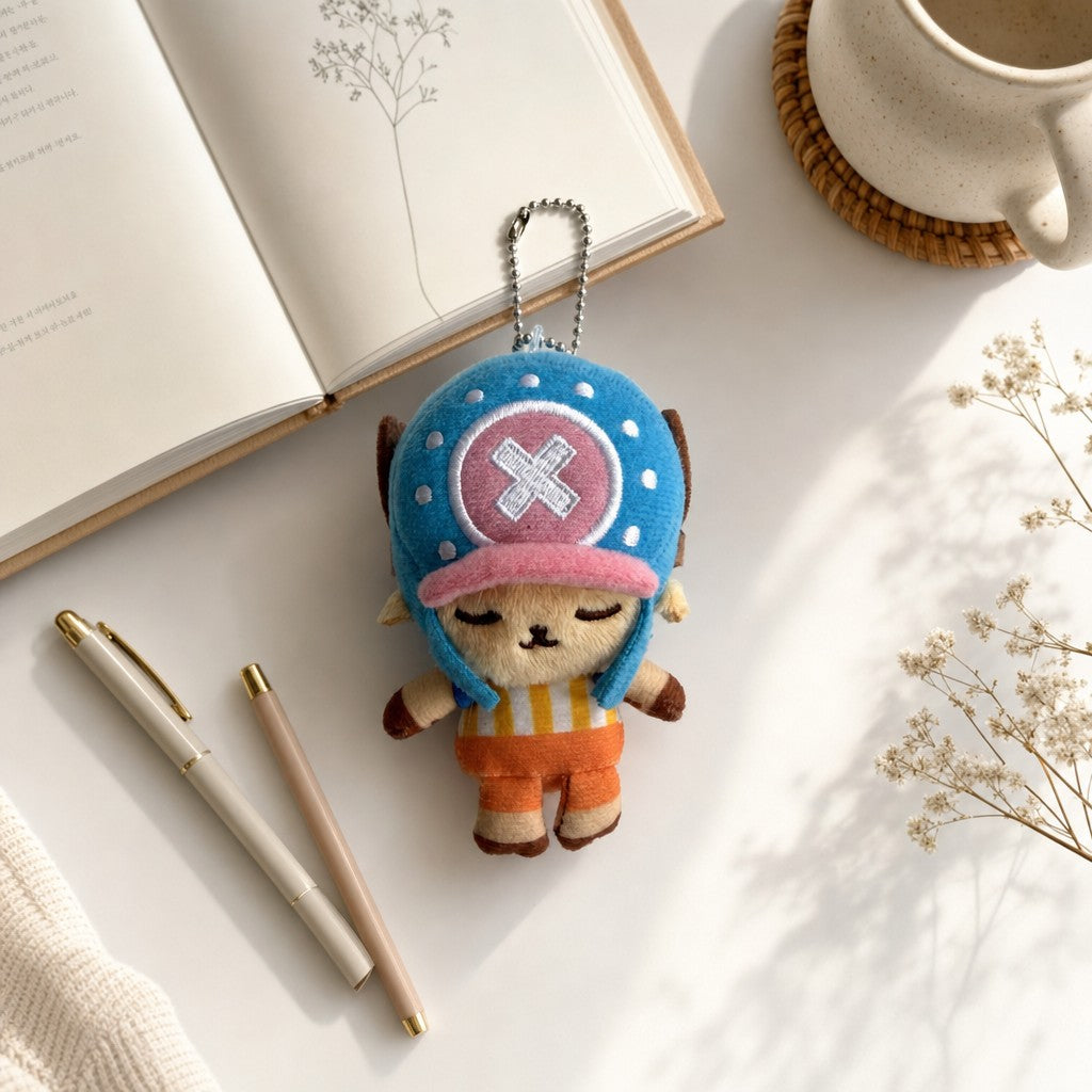 One Piece Tony Tony Chopper plush keychain bag charm displayed with a notebook and coffee for a cozy lifestyle flat lay