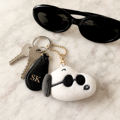 Peanuts Joe Cool mini plush keychain attached to keys, shown as a cute everyday bag charm and keychain accessory
