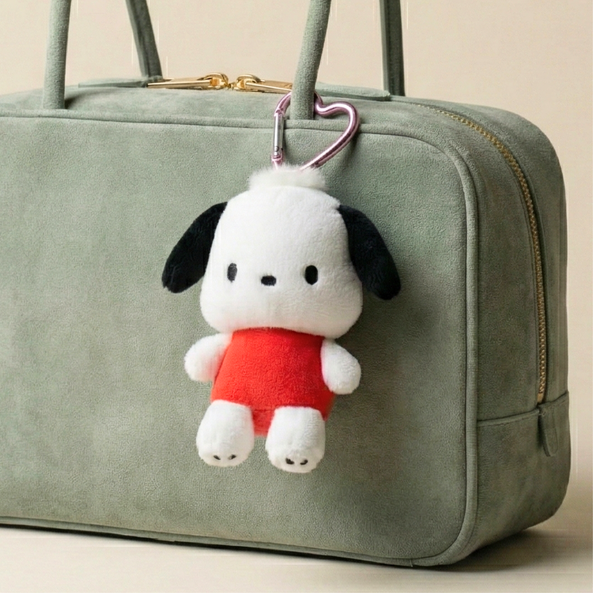 Pochacco mini mascot plush heart carabiner charm clipped to a bag strap as a kawaii Sanrio bag accessory.